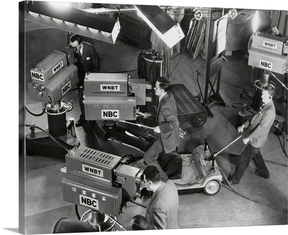 Cameras are tested on the television studio set before the program goes on the air.