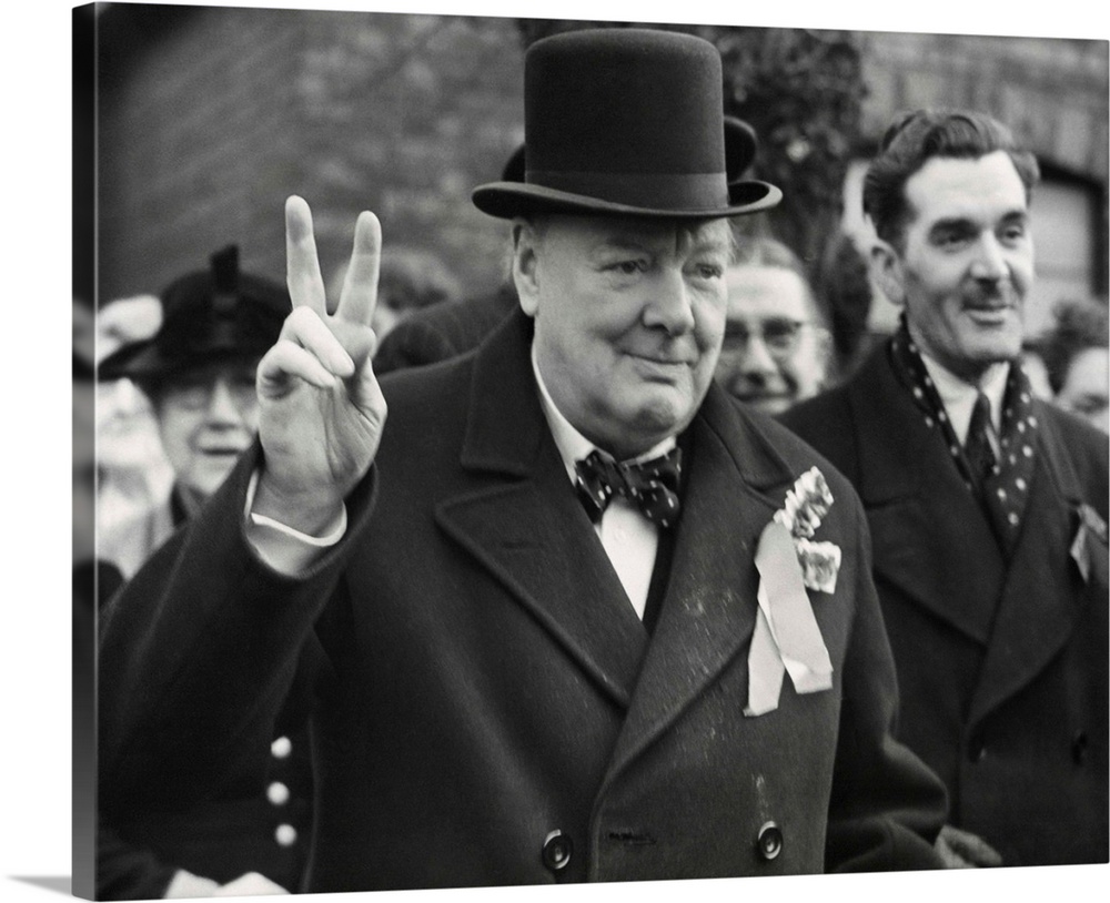 Conservative Party Leader Winston Churchill gives his familiar victory sign. He was making a last-minute campaign tour bef...