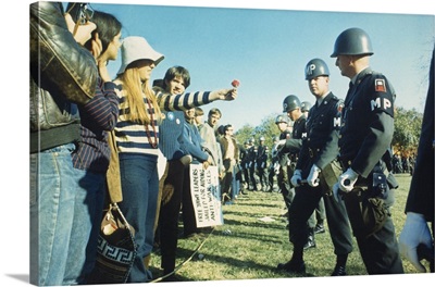 Demonstrator offers a flower to military police during the 1967 March on the Pentagon