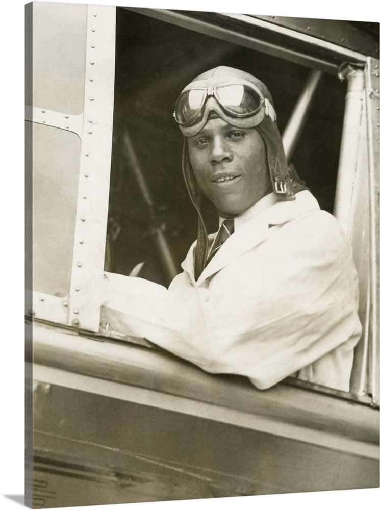 Hubert Julian was the only licensed Black aviator in America. He is in the cockpit of a Bellanca Roma, in his first flying...