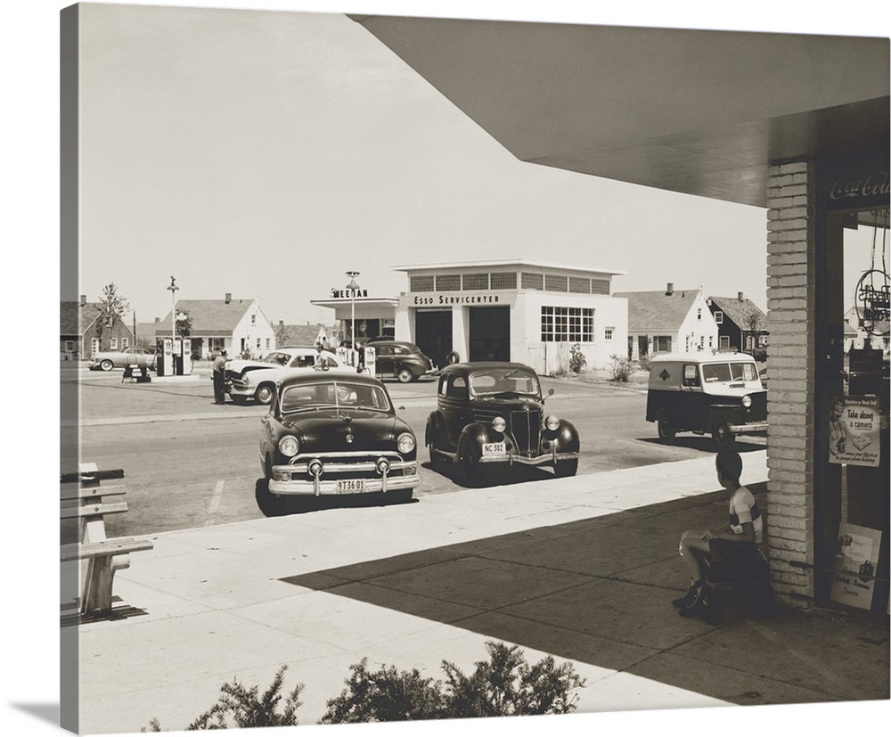 Levittown, N.Y. corner store across the street from a gas station. It was the first mass-produced suburb and had common pu...