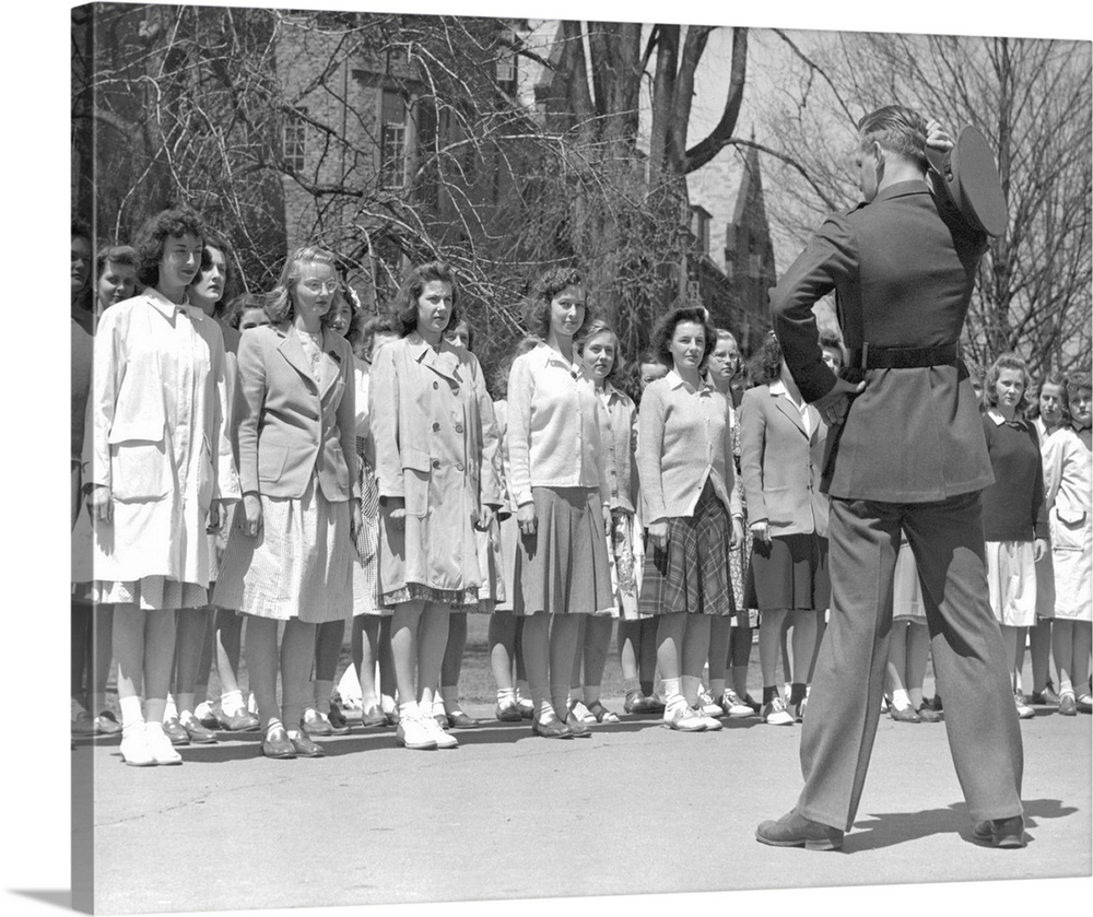 Drill Instructor looks over new arrivals to Marine Corps Women's Reserve Officer's Candidate School. Ca.1945.