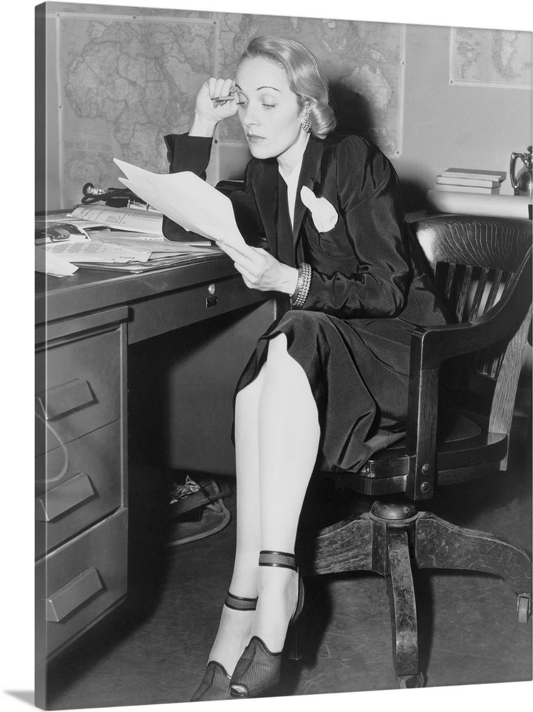 Marlene Dietrich in her office at the U.S. War Department, Bureau of Public Relations, May 1942. As a staunch anti-Nazi, s...