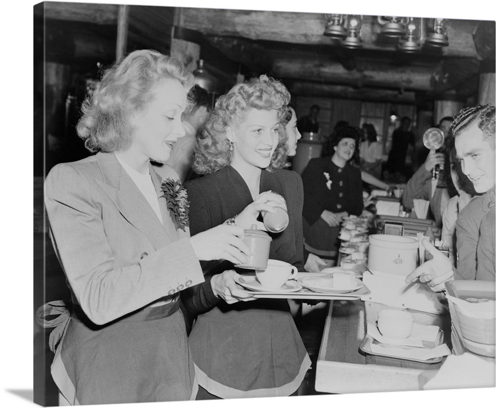 Marlene Dietrich and Rita Hayworth serve soldiers at the Hollywood Canteen during World War II. Nov. 17, 1942.
