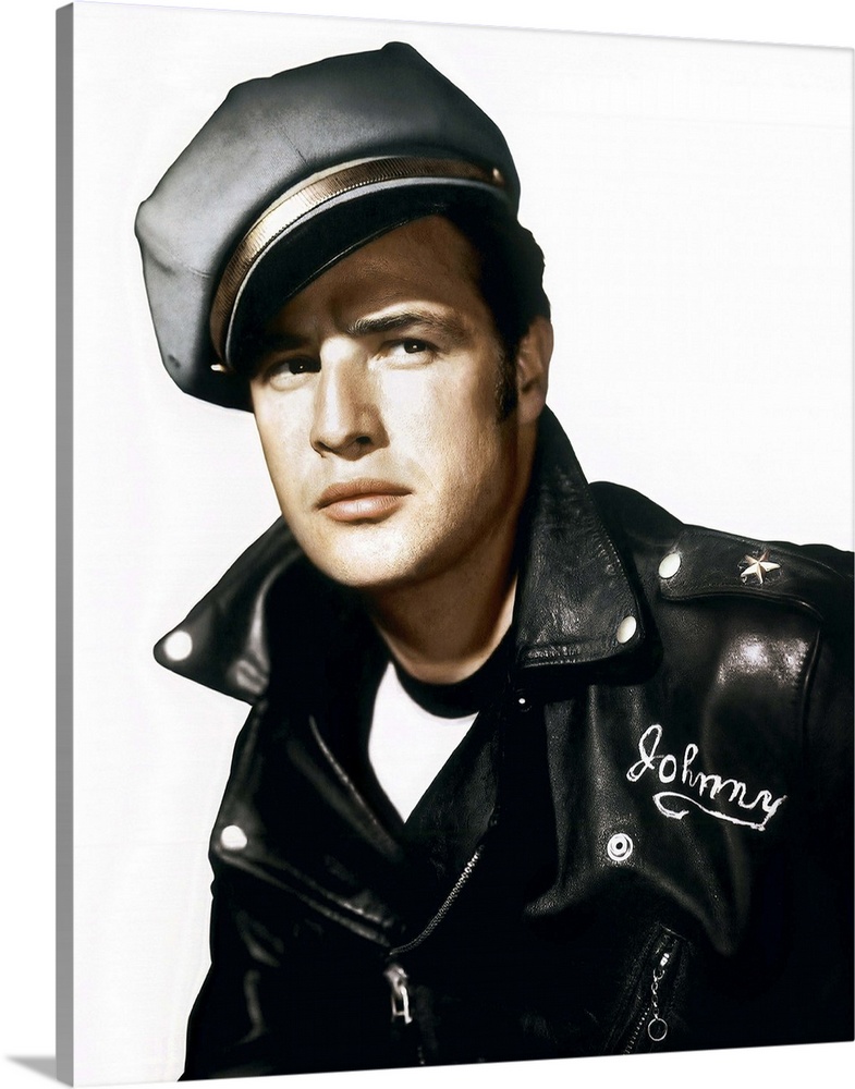 A vintage photograph of Marlon Brando wearing a leather jacket and cap, to promote his movie "The Wild One."