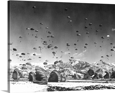 Men And Equipment Being Parachuted To Earth In Operation Conducted By United Nations