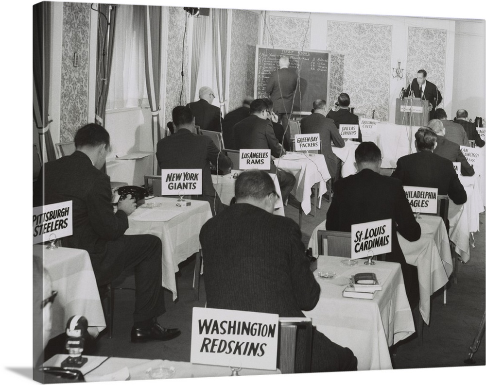 National Football League draft meeting in New York, Nov. 28, 1964. Commissioner Pete Rozelle reads the picks as representa...