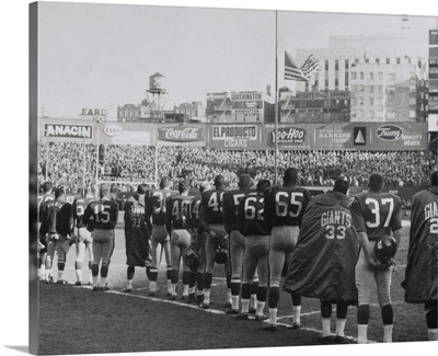 New York Giants football team during a moment of prayer for President John Kennedy