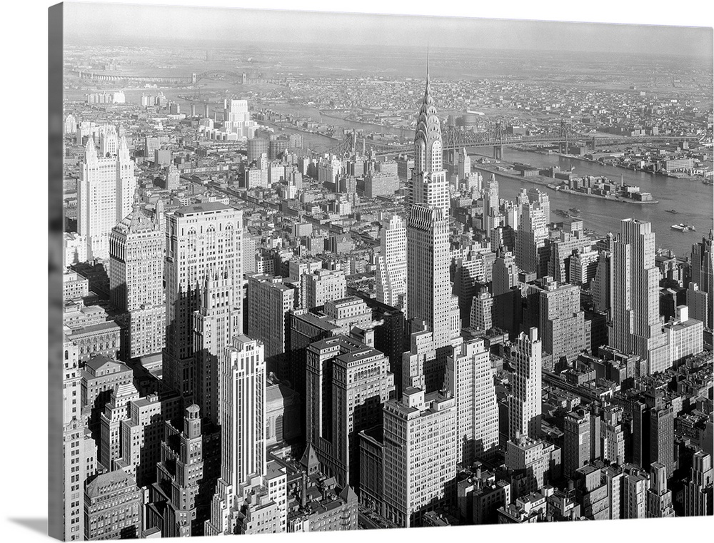 Northeast view from NYC's Empire State Building includes the Chrysler Building. Jan. 19, 1932. In mid-distance is the Quee...