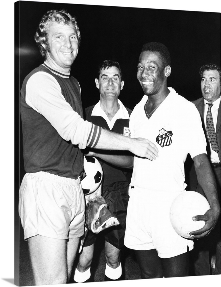 Pele of Santos of Brazil with Bobby Moore, the halfback of West Ham ...