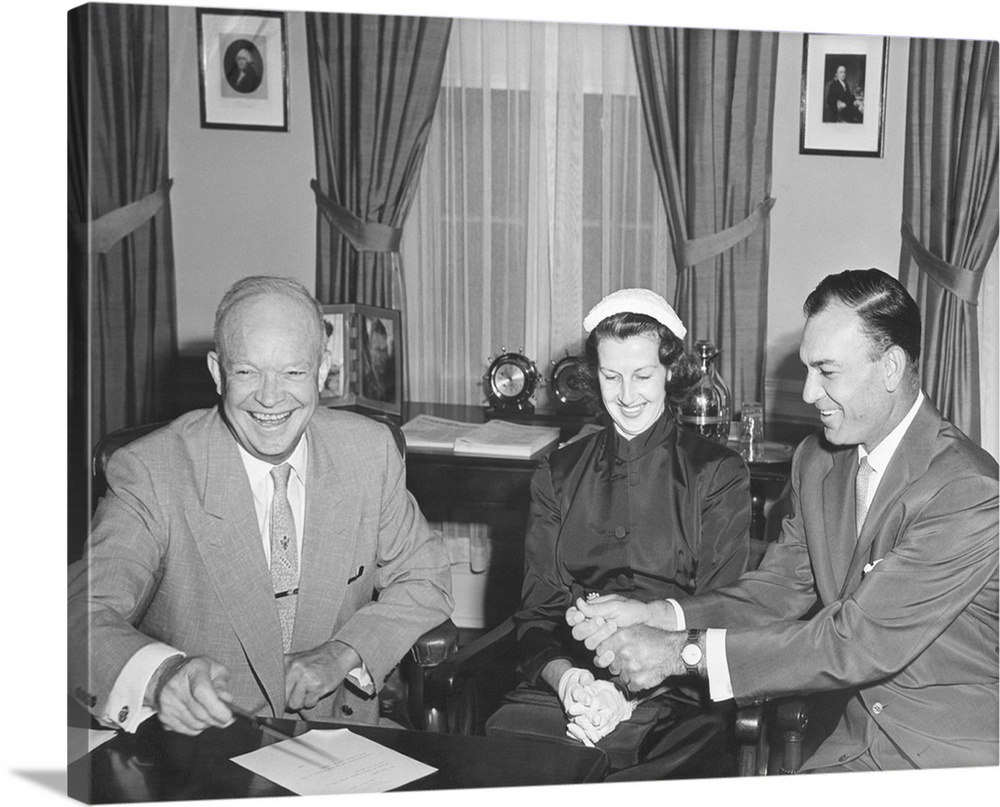 President Eisenhower with Champion Golfer Ben Hogan and his wife in the Oval Office. Aug. 8, 1953