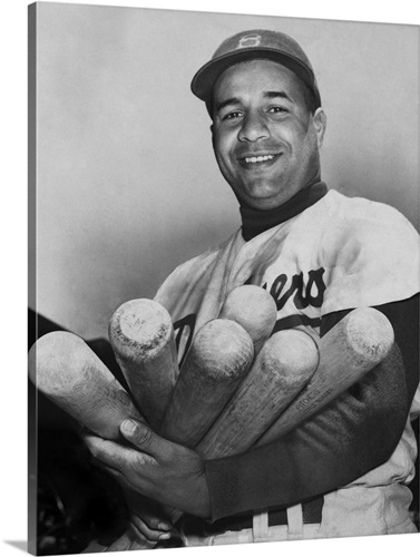 Roy Campanella, catcher for the Brooklyn Dodgers, holding six bats