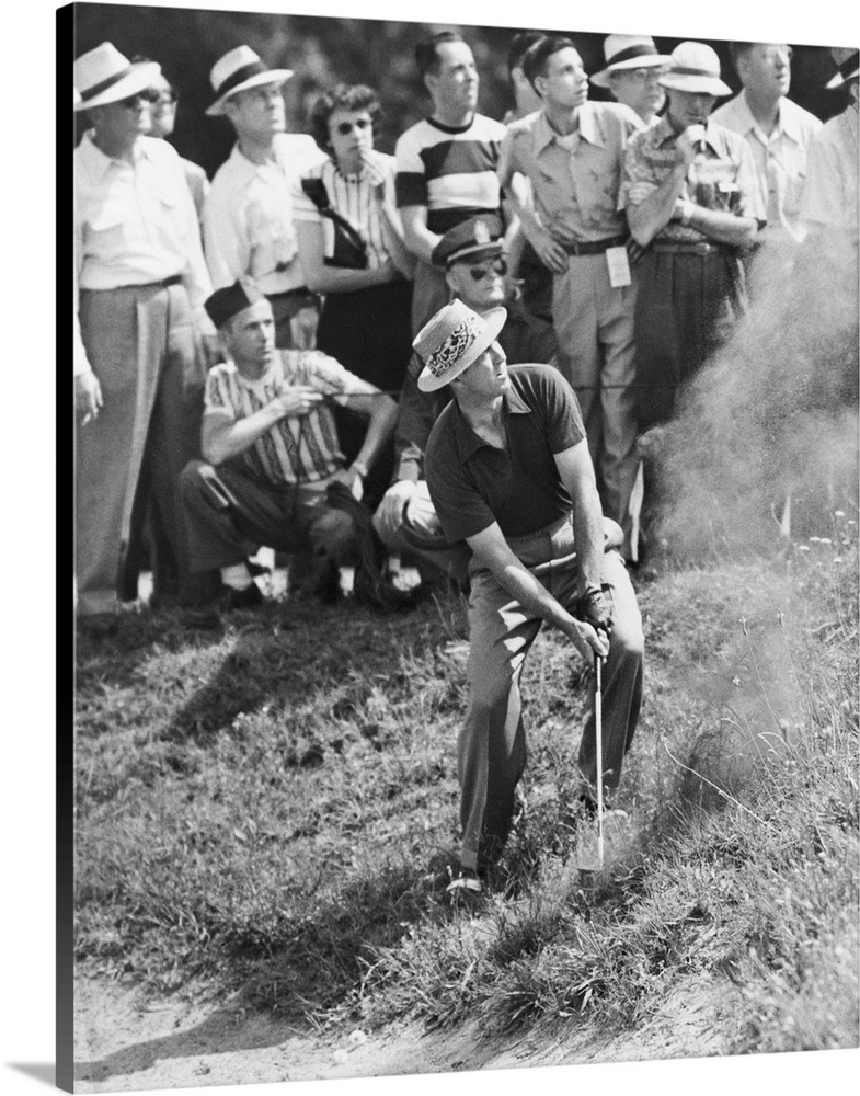 Sam Snead makes an iron shot from the side of a sand trap. Snead won the National PGA championship over Johnny Palmer. Ric...