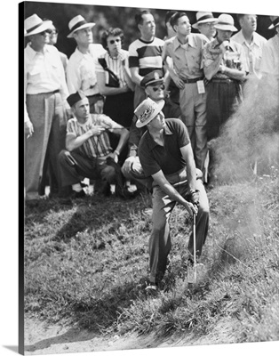 Sam Snead makes an iron shot from the side of a sand trap