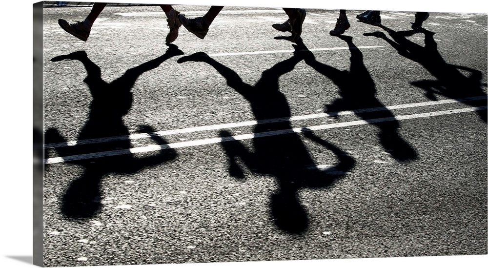 Shadows Of Several Athletes Dance On Road In Bright Sunlight During 20Km Walk Event