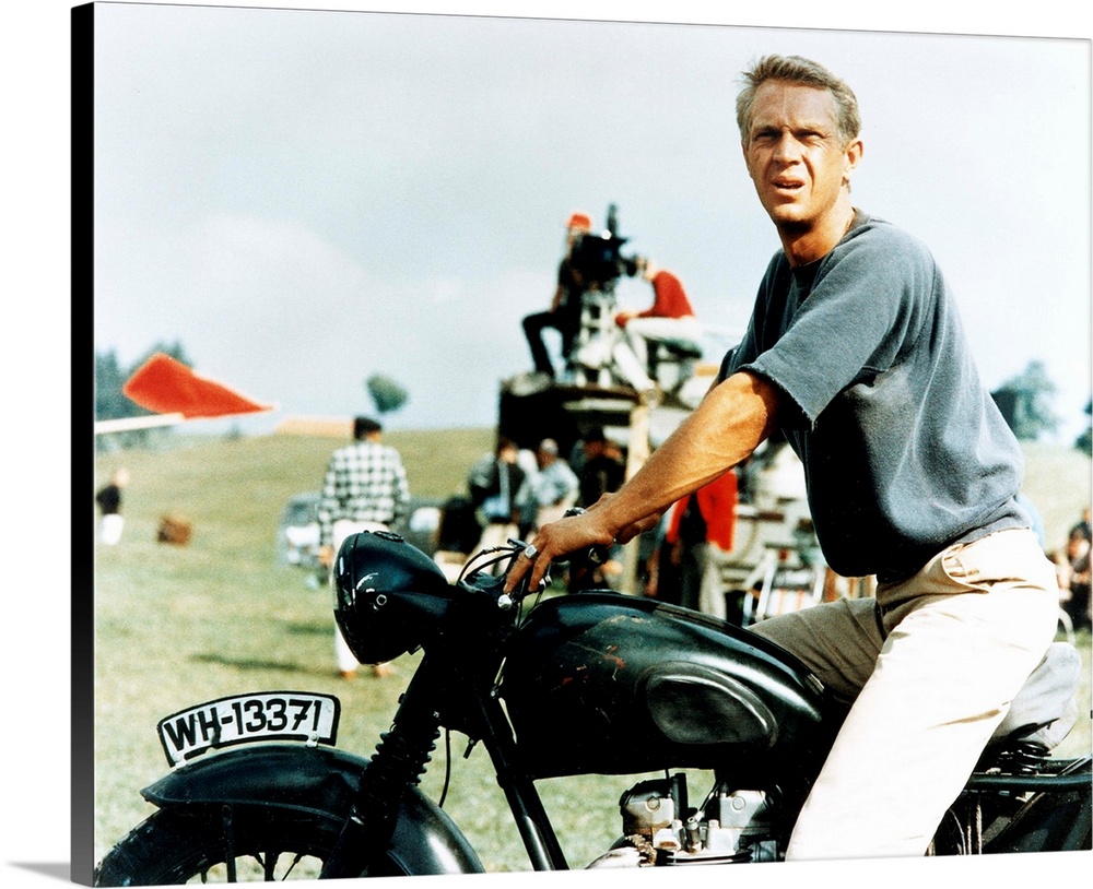 Steve McQueen with motorcycle on the set of GREAT ESCAPE, 1963.