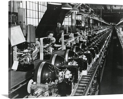 Television chassis on an assembly line with women workers in a US factory, July 1949