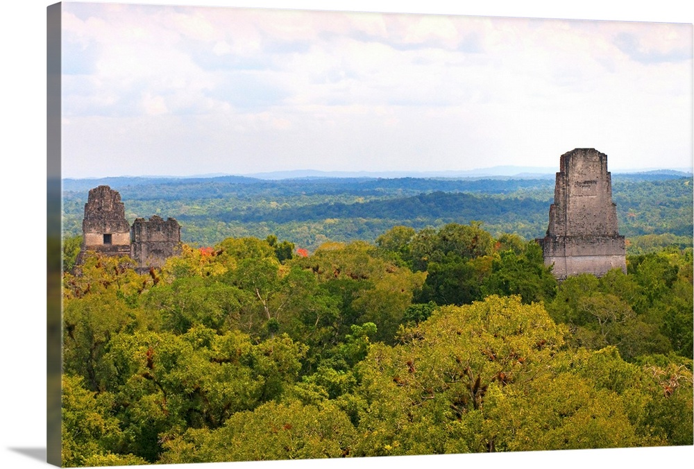 GUATEMALA. Tikal. Tikal National Park. View of the temples I, II and IV standing out the rainforest. Maya art. Architectur...