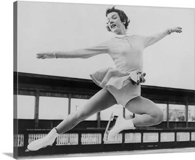 Tenley Albright, figure skater, in mid-air leap, 1954