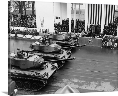 US Army tanks pass Eisenhower's reviewing stand during the Inaugural parade