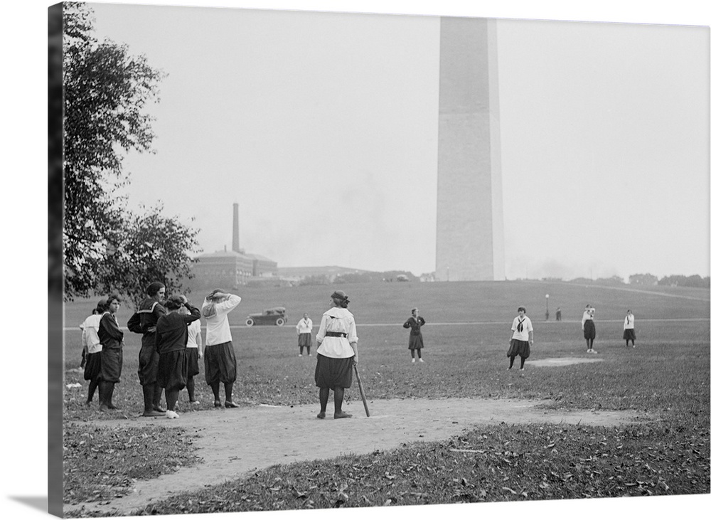 Young women in bloomers and middy shirts playing baseball on the National Mall. Oct 19, 1919. Washington, D.C.