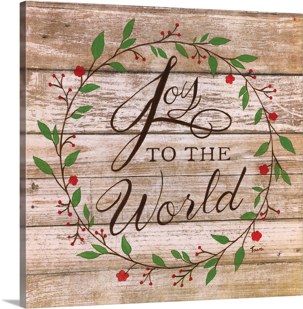 ?Joy to the World? handwritten inside a wreath on a wooden background.�