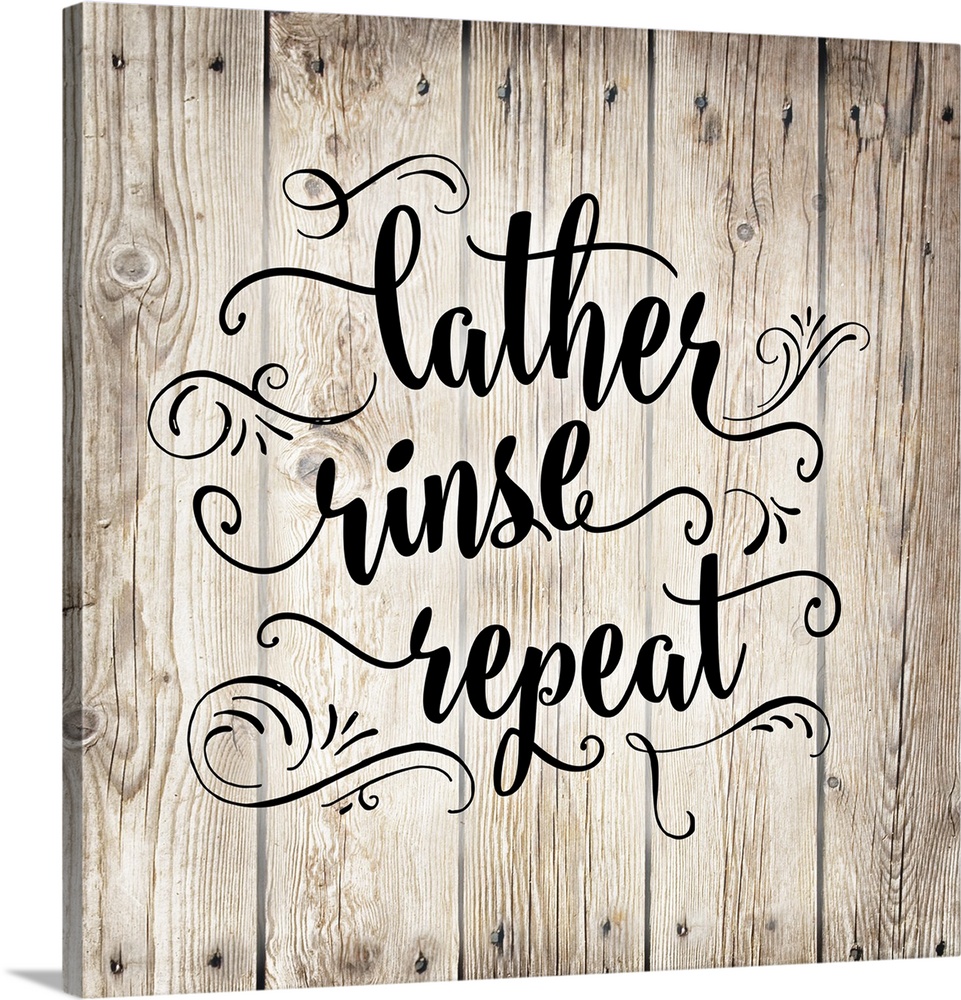 The words "Lather, rinse, repeat" is arranged on this square light wood design with decorated embellishments around the text.