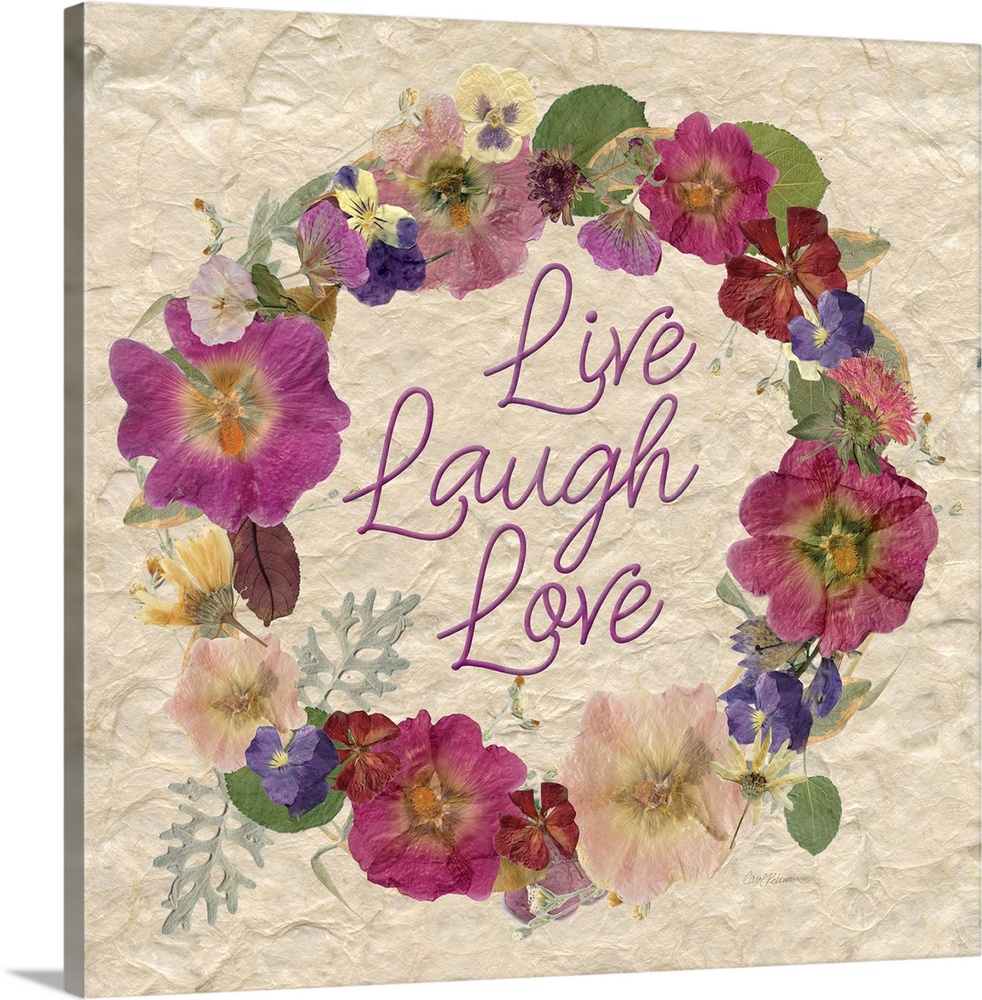 A wreath of various dried flowers and foliage surround the words, "Live, laugh, love" on a natural fibrous paper.
