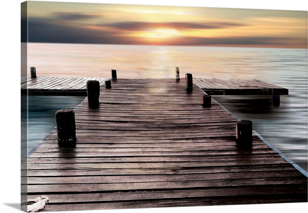 A photo of a dock with the sky and water taken with a long exposure.
