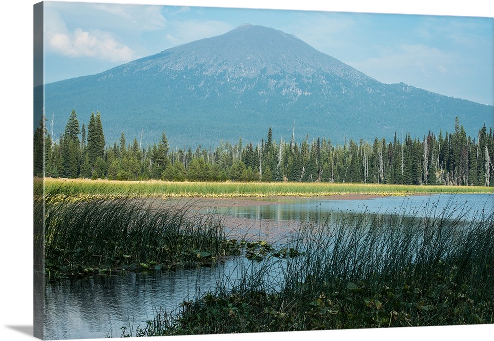 Landscape photograph of water in front of Mount Bachelor in Oregon.