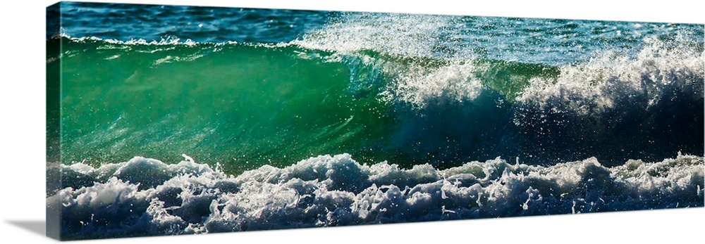 Panoramic photograph of an ocean wave.