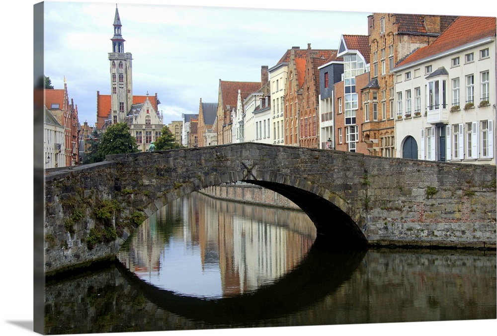 Photograph of an old stone bridge in Belgium over a river.