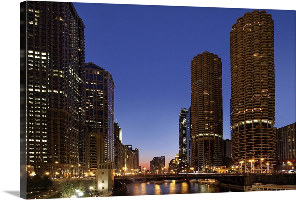 Dusk scene of Chicago skyline with Marina Towers along river