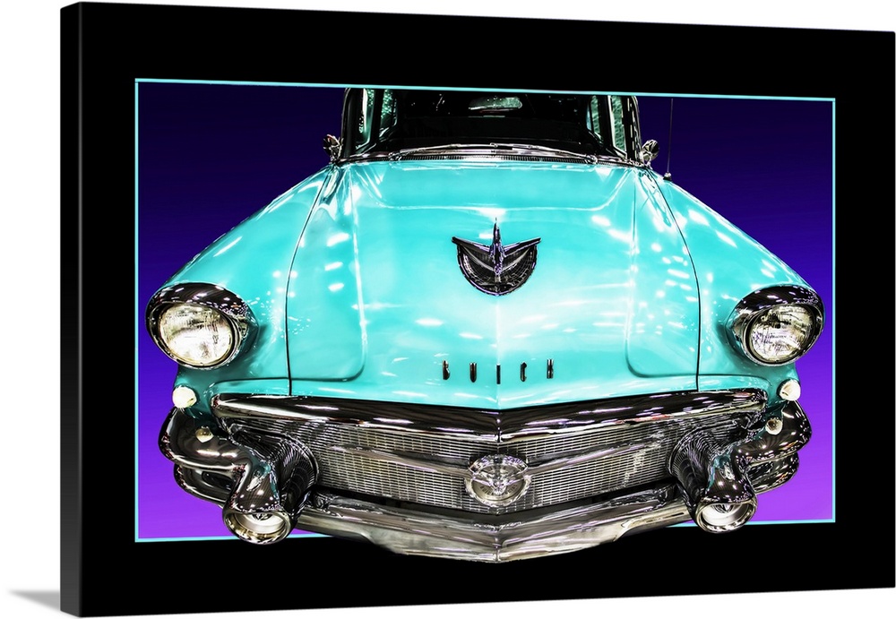The headlights and grill of a teal blue muscle car with a faux black border.