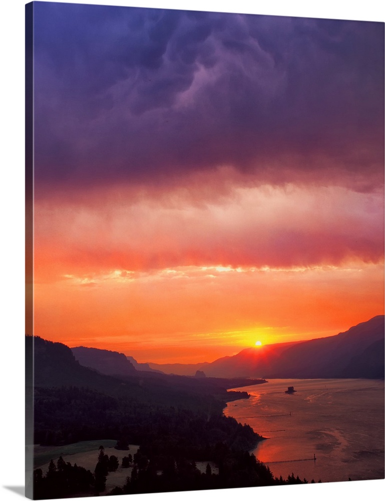 Fiery sunset with a cloudy sky over the Columbia River Gorge.
