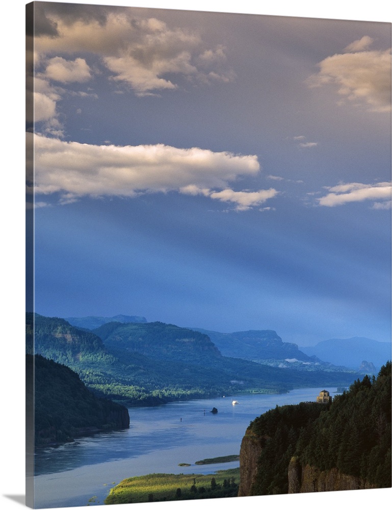 A bright blue sky with clouds over the Columbia River Gorge.