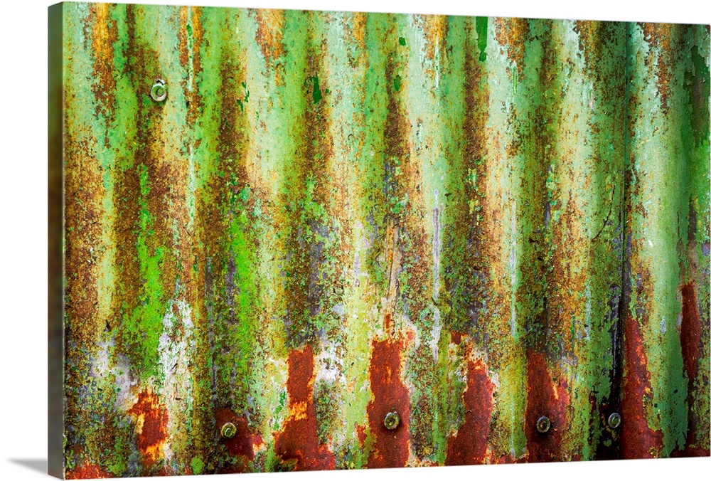 Close up of rusty green corrugated metal, creating an abstract image.