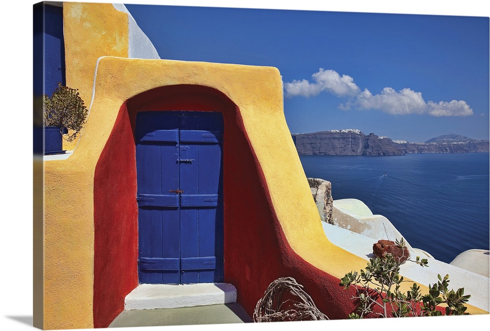 Photo on canvas of a doorway of a house on a cliff overlooking the ocean.