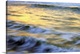 image thumbnail of Soft photograph of a sunset reflecting light on the ocean waves.