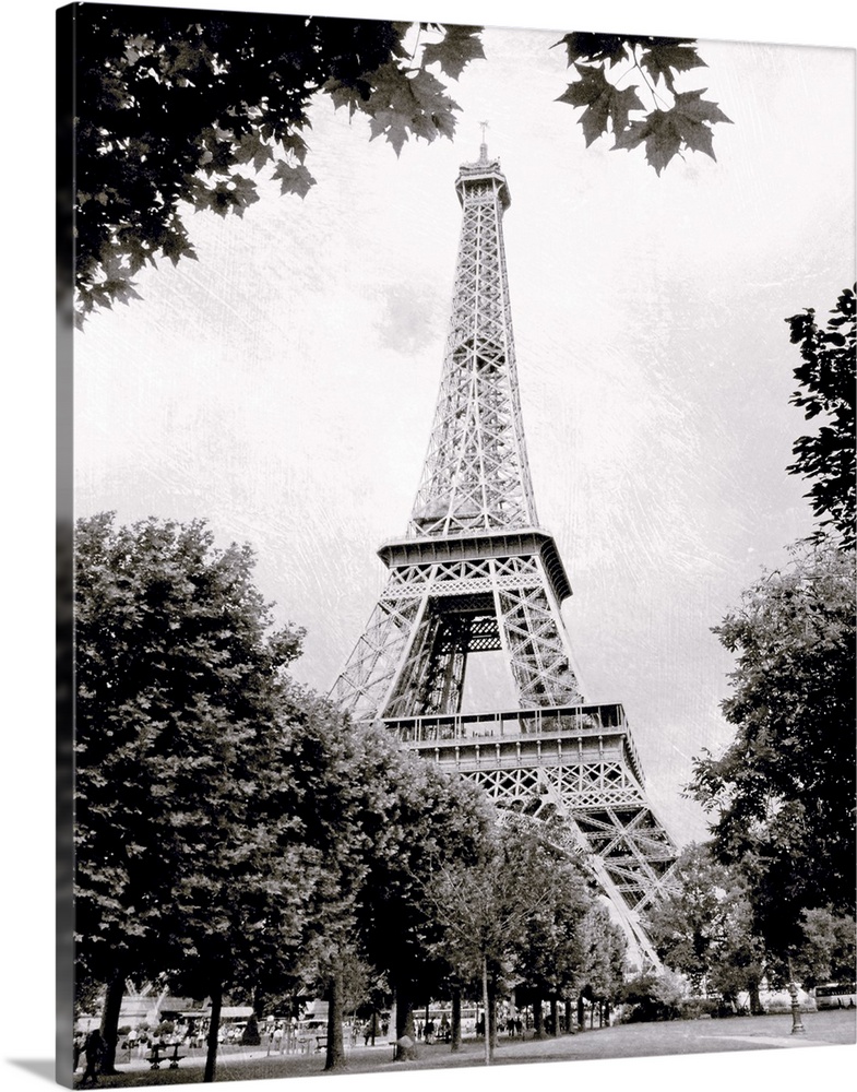 Large vertical black-and-white photograph of the Eiffel Tower in Paris, France.