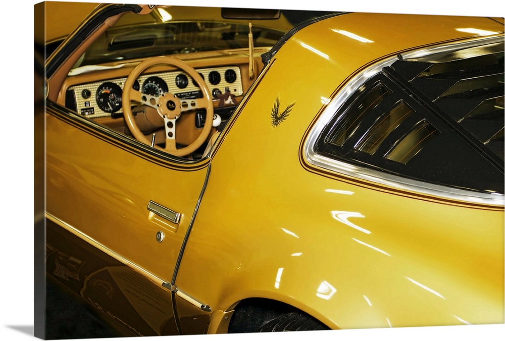 Fine art photograph of a vintage car. The interior and steering wheel are visible.