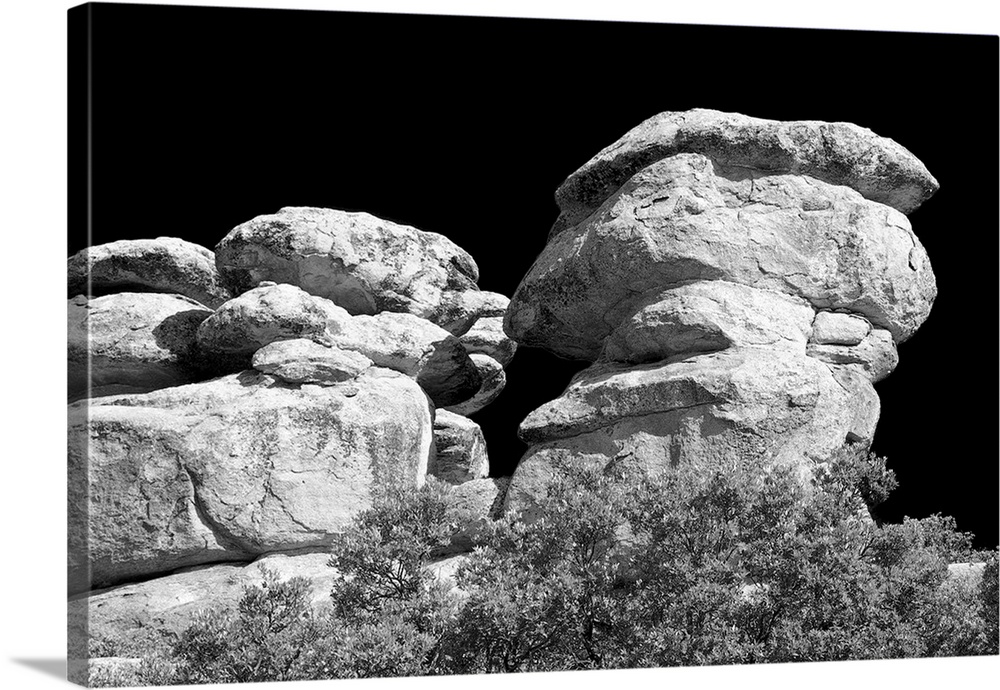 Black and white photograph of stacked rock formations.
