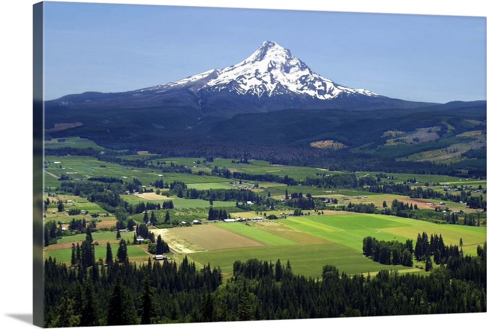 Landscape photograph of the town of Hood River with Mount Hood in the distance.