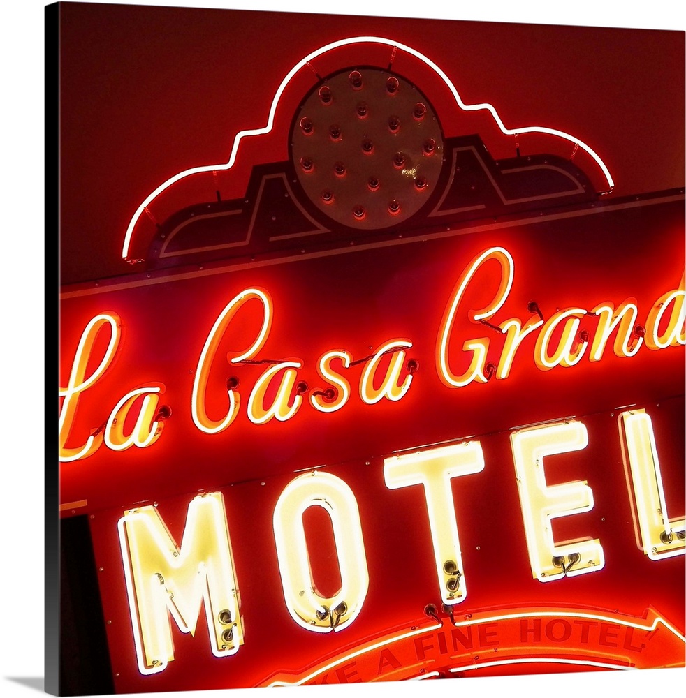 Square photograph of a lit, neon red sign that says "La Casa Grande Motel"