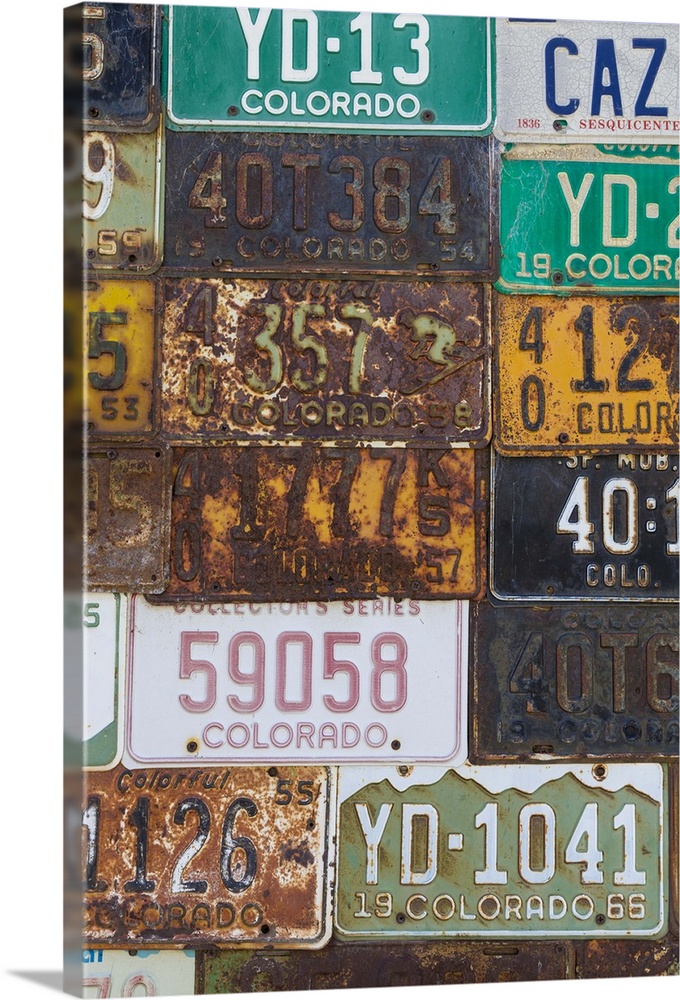 A collection of vintage license plates.