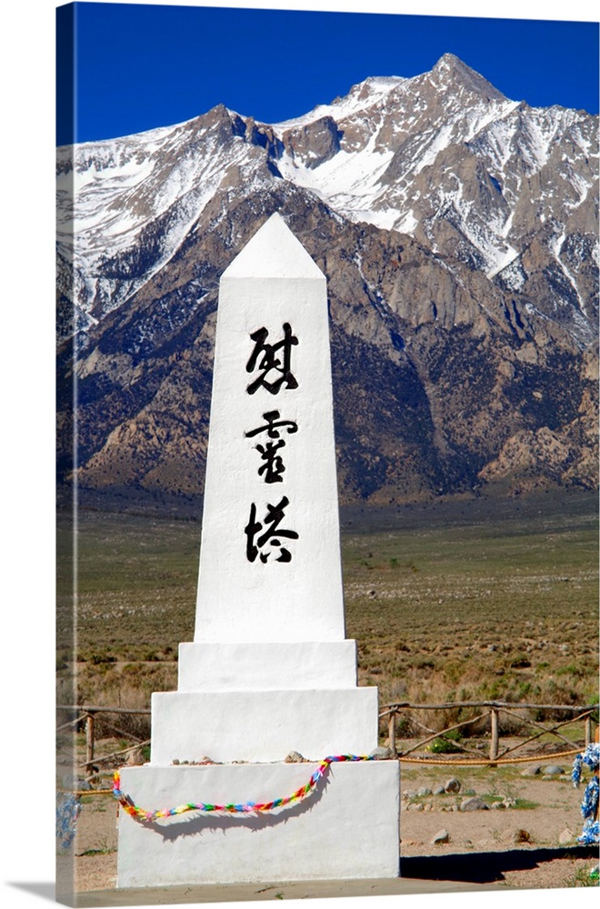 Photograph of the Manzanar Remembrance monument with the Sierra Nevadas in the background.