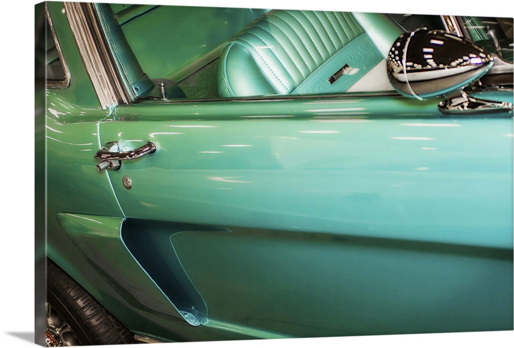 Fine art photograph of the door and back wheel of a vintage car.