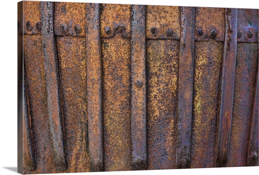 A close up photo of metal elements that have rusted over time.