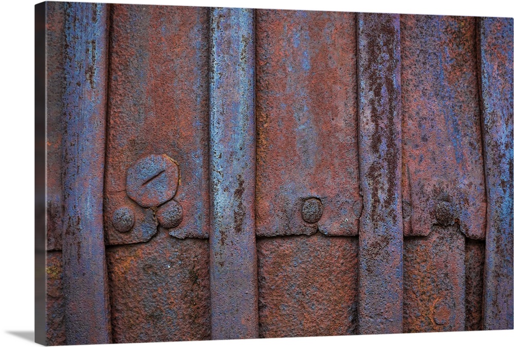 A close up photo of metal elements that have rusted over time.