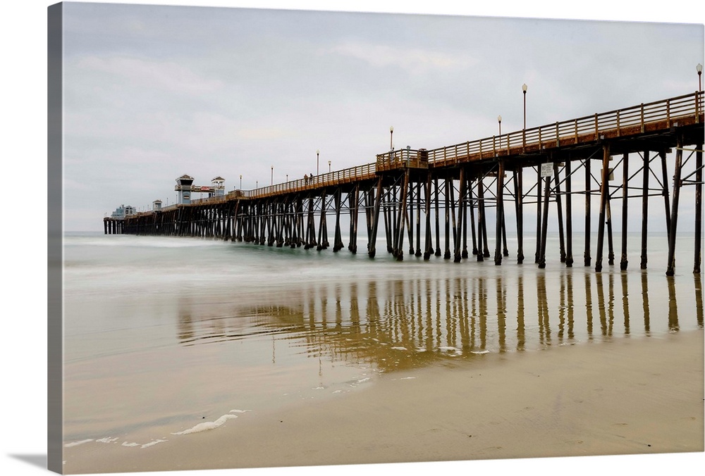 Photograph of Oceanside Pier at low tide.
